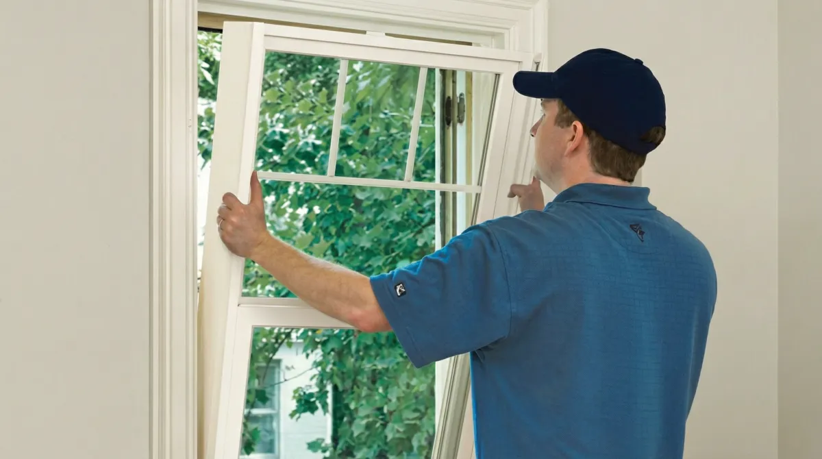 Professional contractors performing a residential window insulation and replacement service in Providence, RI